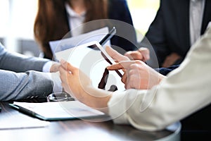 Office worker using a touchpad to analyze statistical data