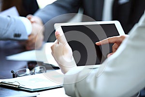 Office worker using a touchpad to analyze statistical data