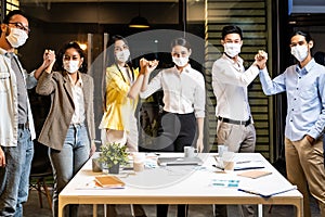 Office worker wear face mask in meeting room alternative greeting in new normal lifestyle