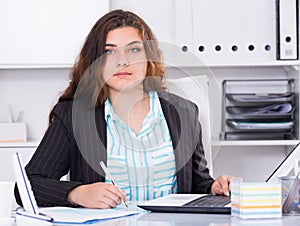 Office worker woman is having productive day at work