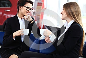 Office workers on coffee break, woman enjoying chatting