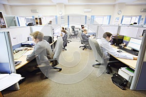 Office workers of company RUSELPROM sit at computers