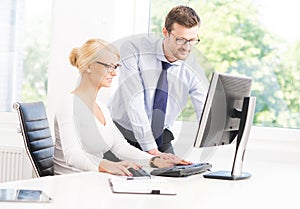 Office workers in formalwear working using computers