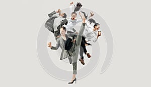 Office workers jumping isolated on studio background