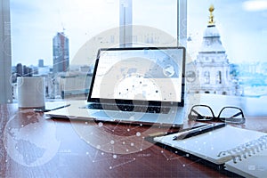 Office workplace with laptop and smart phone on wood table