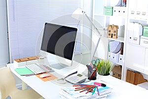 Office workplace with laptop and smart phone on wood table