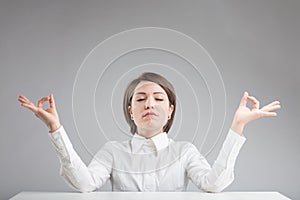 Office zen woman relaxing and meditating