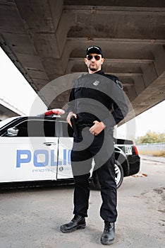 Officer of police holding gun near
