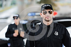 Officer of police in sunglasses near