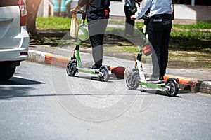 An officer is riding a electric scooter on the road