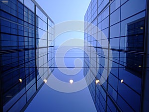 Offices glass windows with clear blue sky above 2