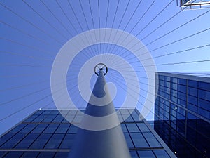 Offices glass windows with wired pole clear blue sky above