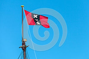 The official Amsterdam flag on top of the mast of a sailship
