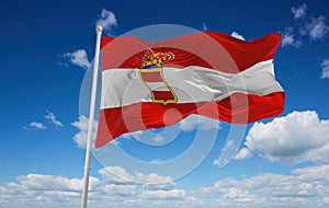 official flag of Austro Hungarian Naval Jack 1894 Austria at cloudy sky background on sunset, panoramic view. Austrian travel and