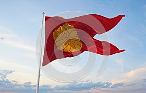 official flag of Empress Dowager, Japan at cloudy sky background photo