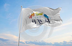 official flag of Icheon city, South Korea at cloudy sky backgrou