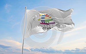 official flag of Iksan city, South Korea at cloudy sky backgroun