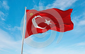 official flag of President of Turkey Turkey at cloudy sky background on sunset, panoramic view. Turkish travel and patriot concept photo