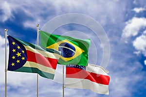 Official flags of the country Brazil, state of Amazonas and city of Parintins. Swaying in the wind under the blue sky. 3d