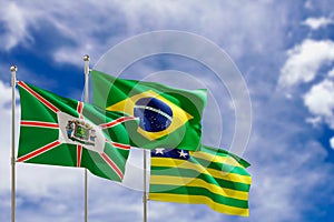 Official flags of the country Brazil, state of Goias and city of Goiania. Swaying in the wind under the blue sky. 3d rendering