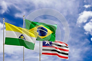 Official flags of the country Brazil, state of Maranhao and city of Imperatriz. Swaying in the wind under the blue sky. 3d