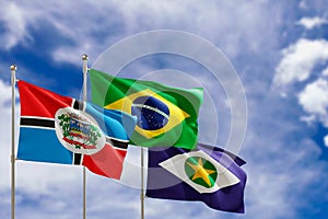 Official flags of the country Brazil, state of Mato Grosso and city of Rondonopolis. Swaying in the wind under the blue sky. 3d