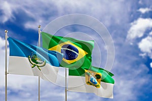 Official flags of the country Brazil, state of Rio Grande do Norte and city of Mossoro. Swaying in the wind under the blue sky. 3d
