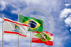 Official flags of the country Brazil, state of Santa Catarina and city of Florianopolis. Swaying in the wind under the blue sky.