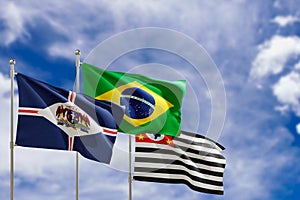 Official flags of the country Brazil, state of Sao Paulo and city of Guarulhos. Swaying in the wind under the blue sky. 3d