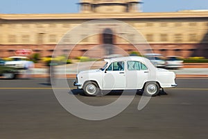 Official Hindustan Ambassador car driving outside North Block, S