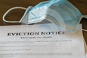 Official legal eviction order or notice to renter or tenant of home with face mask