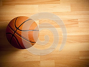 An official orange ball on a basketball court