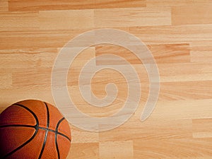 An official orange ball on a basketball court