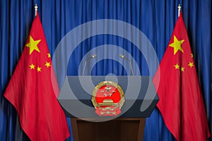 Official press conference of China fgoverment or president. Tribune, flags of China and microphones