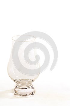 An official whiskey glancairn glass on a white background - portrait view