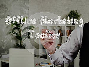 Offline Marketing Tactics phrase on the piece of paper photo