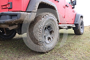 Offroad car concept with dirty road, wheel close-up.
