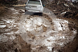 Offroad car in dirt back view