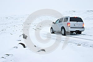 Offroad Car on the Snowy Road