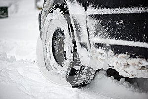 Offroad car tires stuck in the snow