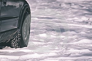 offroad car tires stuck in the snow - vintage look edit