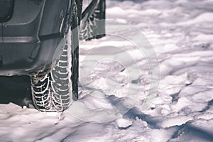 offroad car tires stuck in the snow - vintage look edit