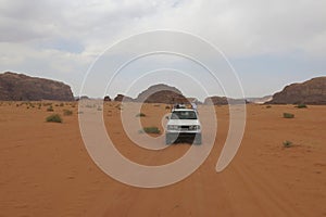 OffRoad Vans Carrying Passengers and Equipment Across Desert Terrain