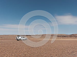 Offroad vehicle in stone desert