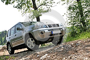 Offroader between trees