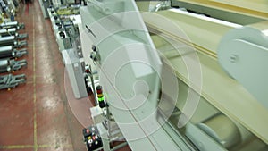 Offset printing press during production of printed paper products