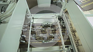 Offset printing press during production of printed paper products