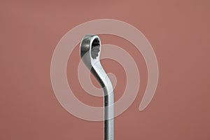 Offset ring spanner wrench on isolated background