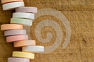 Offset stack of small circular sweetened candies
