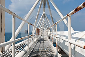 Offshore bridge with pipe work